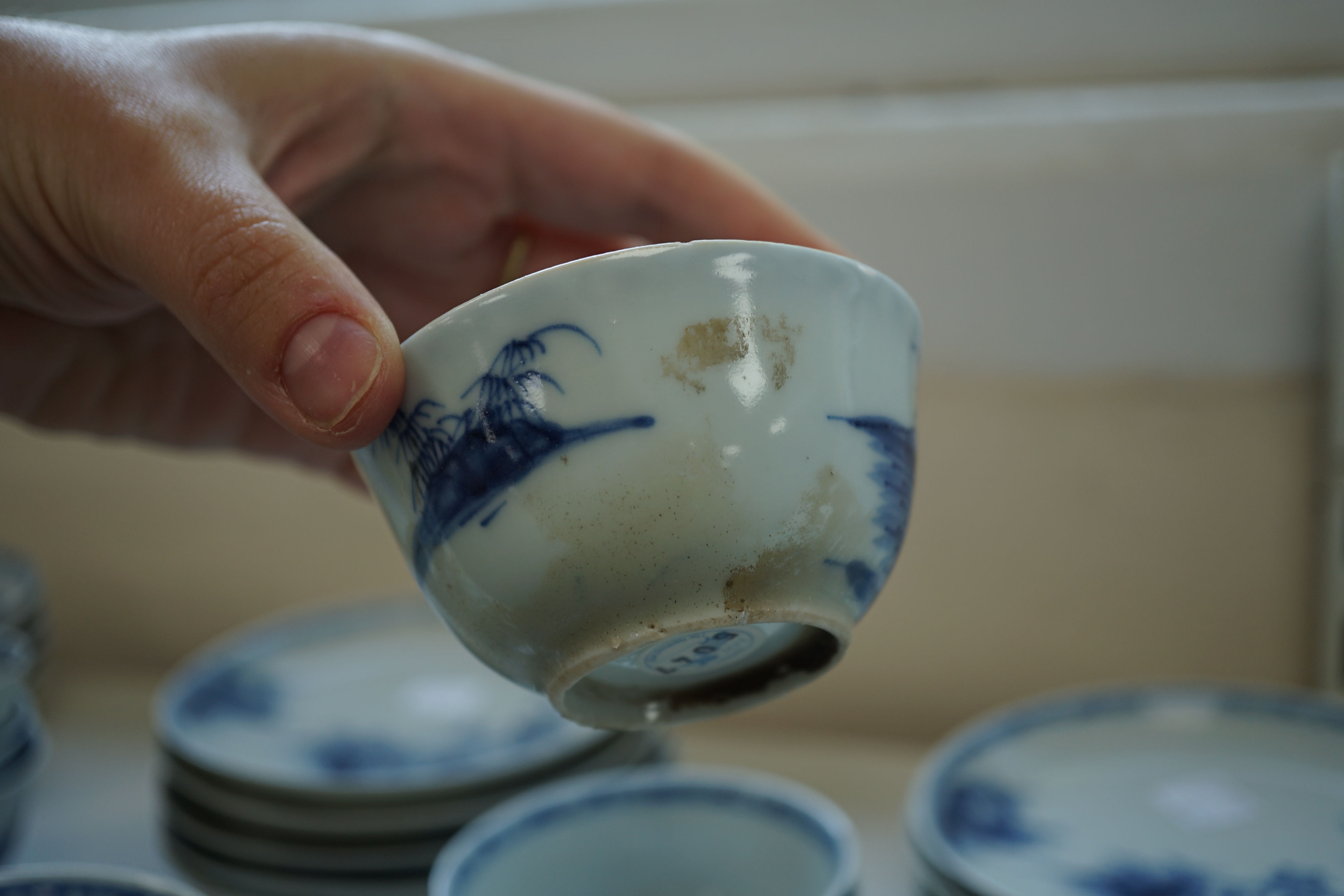 A set of twenty four Chinese Nanking Cargo blue and white ‘large pagoda’ tea bowls and saucers, Qianlong period